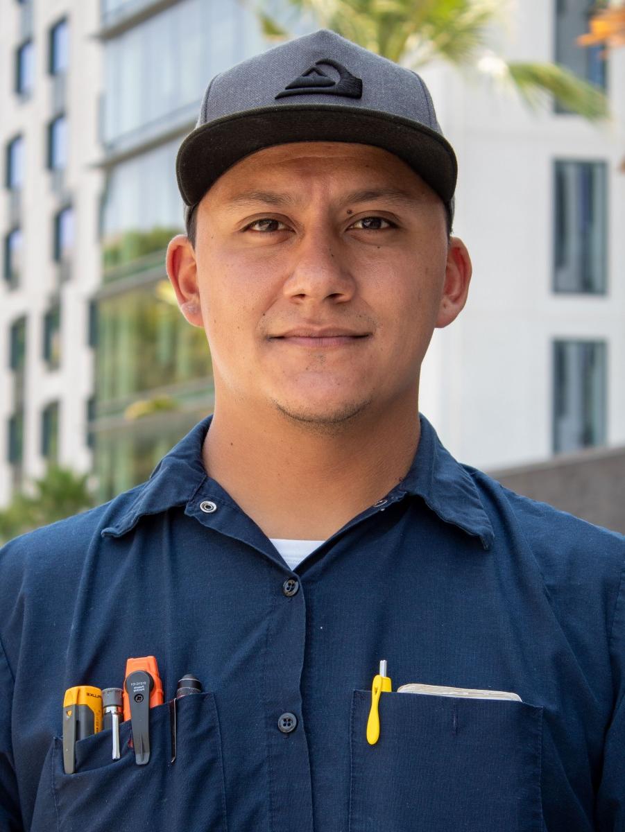 Person wearing a baseball cap.