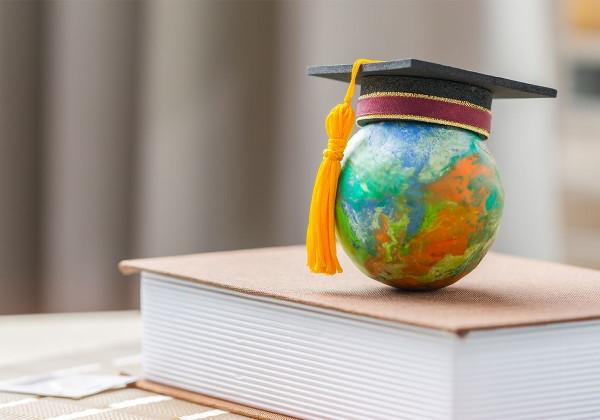 graduation cap on world globe